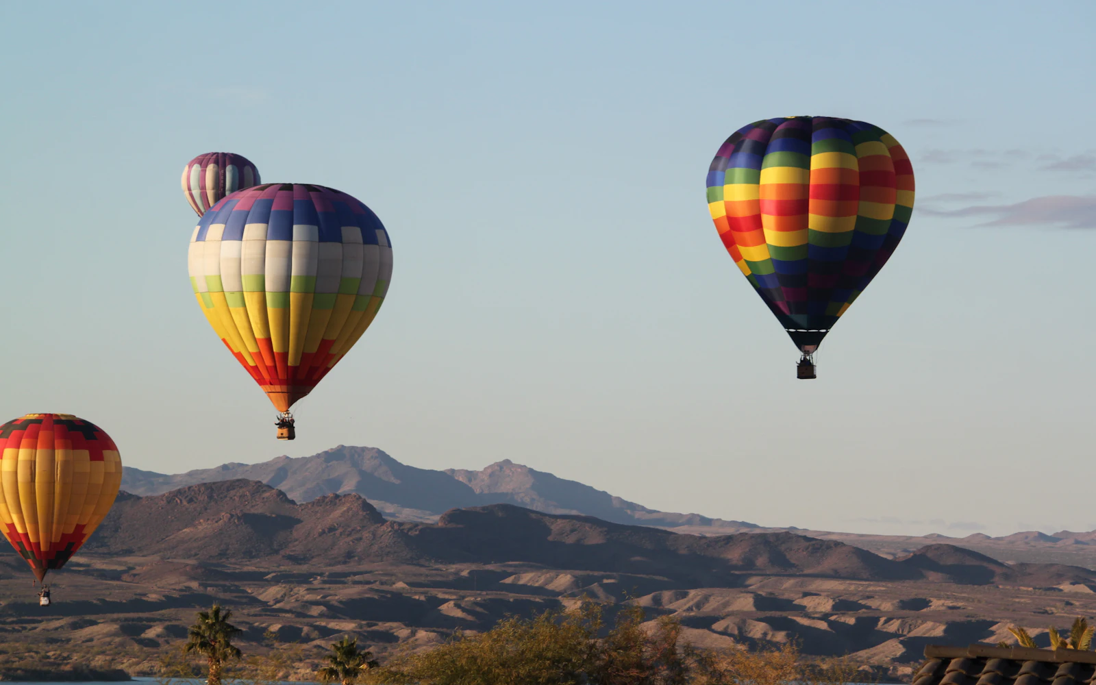 Hot air balloons above the mountains